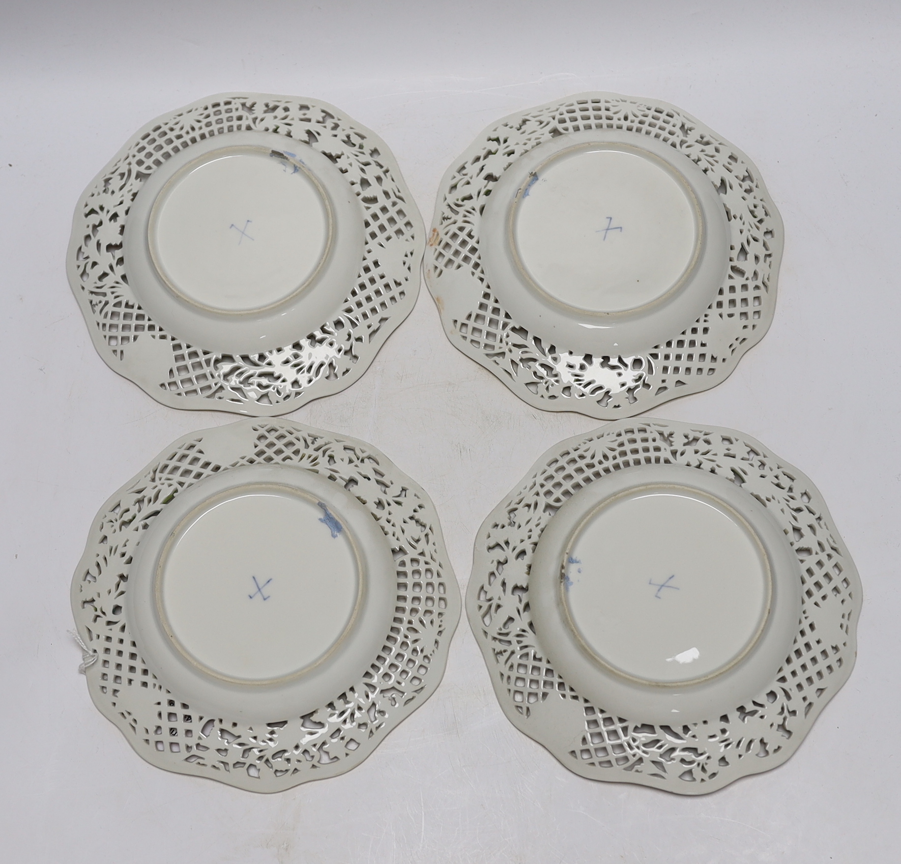 A set of four Dresden cabinet plates decorated with lovers, 22cm high